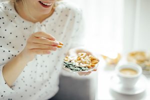 a woman snacking on nuts