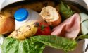 a bin overflowing with food waste